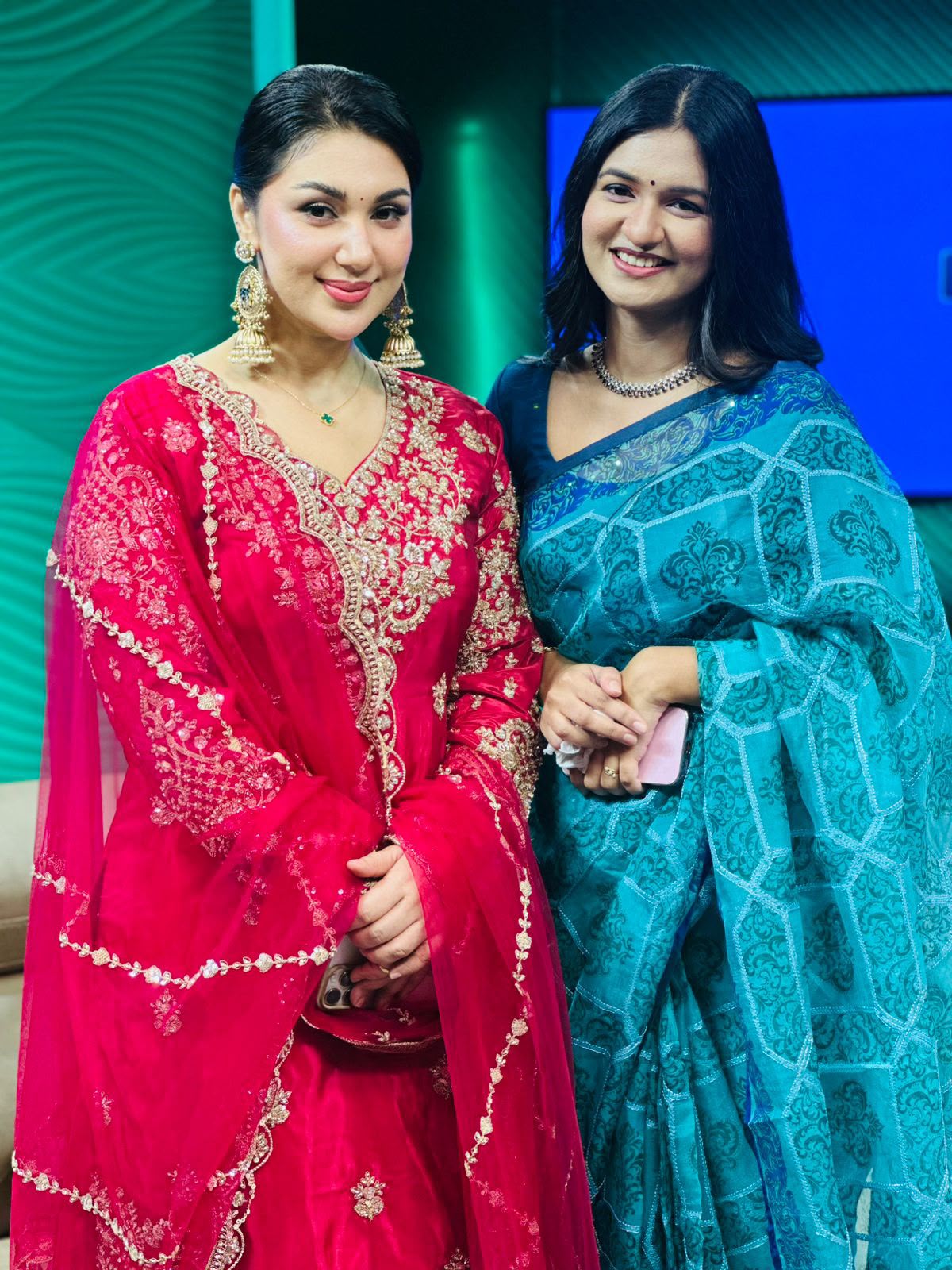 Sanjida Rahman in a blue and gold saree with a guest in the Channel i studio